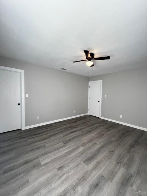 2912 Ozark Avenue McAllen, TX 78504 - Photo 20 of 21 a view of an empty room with a ceiling fan and wooden floor