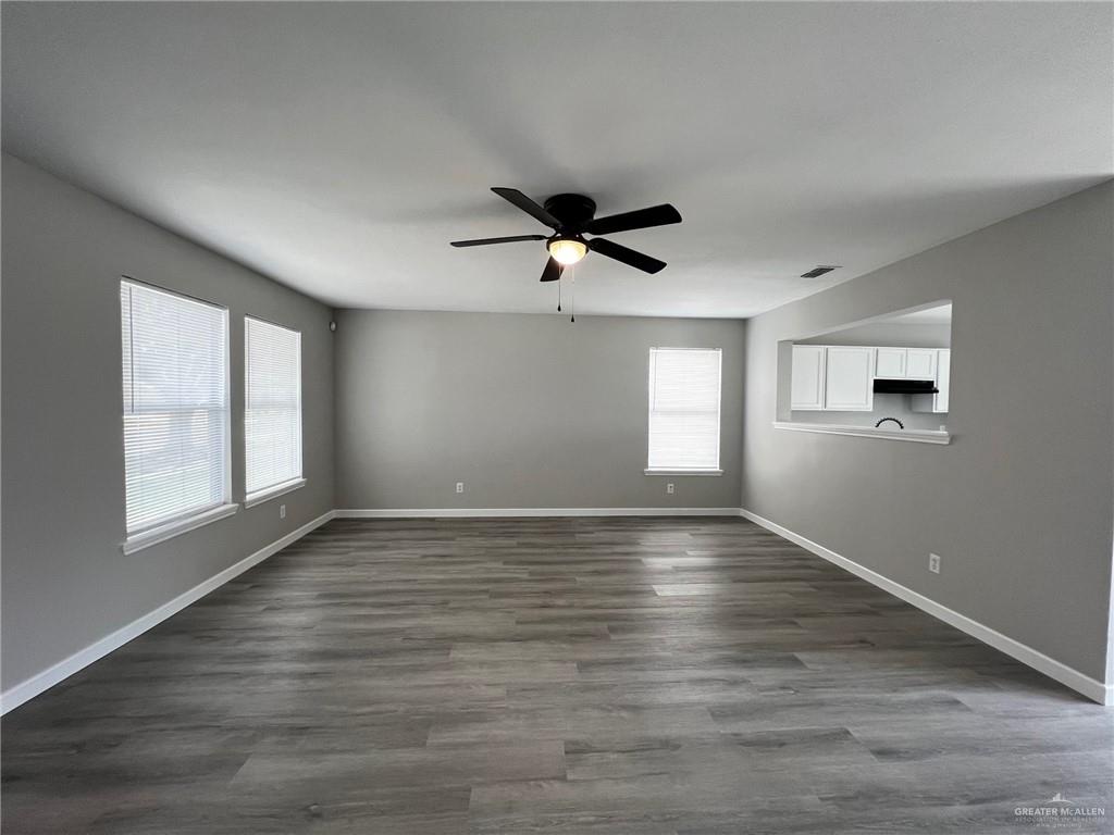 2912 Ozark Avenue McAllen, TX 78504 - Photo 2 of 21 an empty room with wooden floor and windows