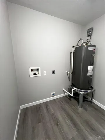 a view of a workspace with wooden floor