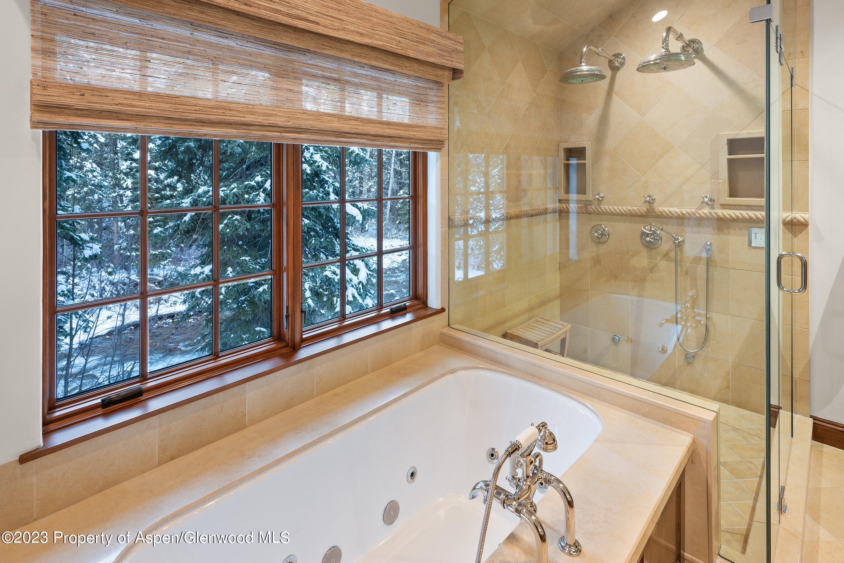 1819 Maroon Creek Road Aspen, CO 81611 - Photo 14 of 43 a bathroom with a bathtub and a shower