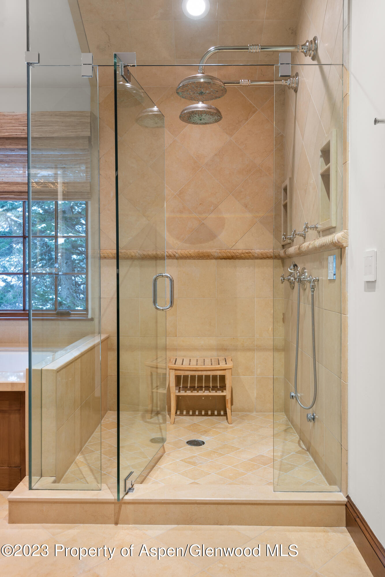 1819 Maroon Creek Road Aspen, CO 81611 - Photo 15 of 43 a bathroom with a glass shower door