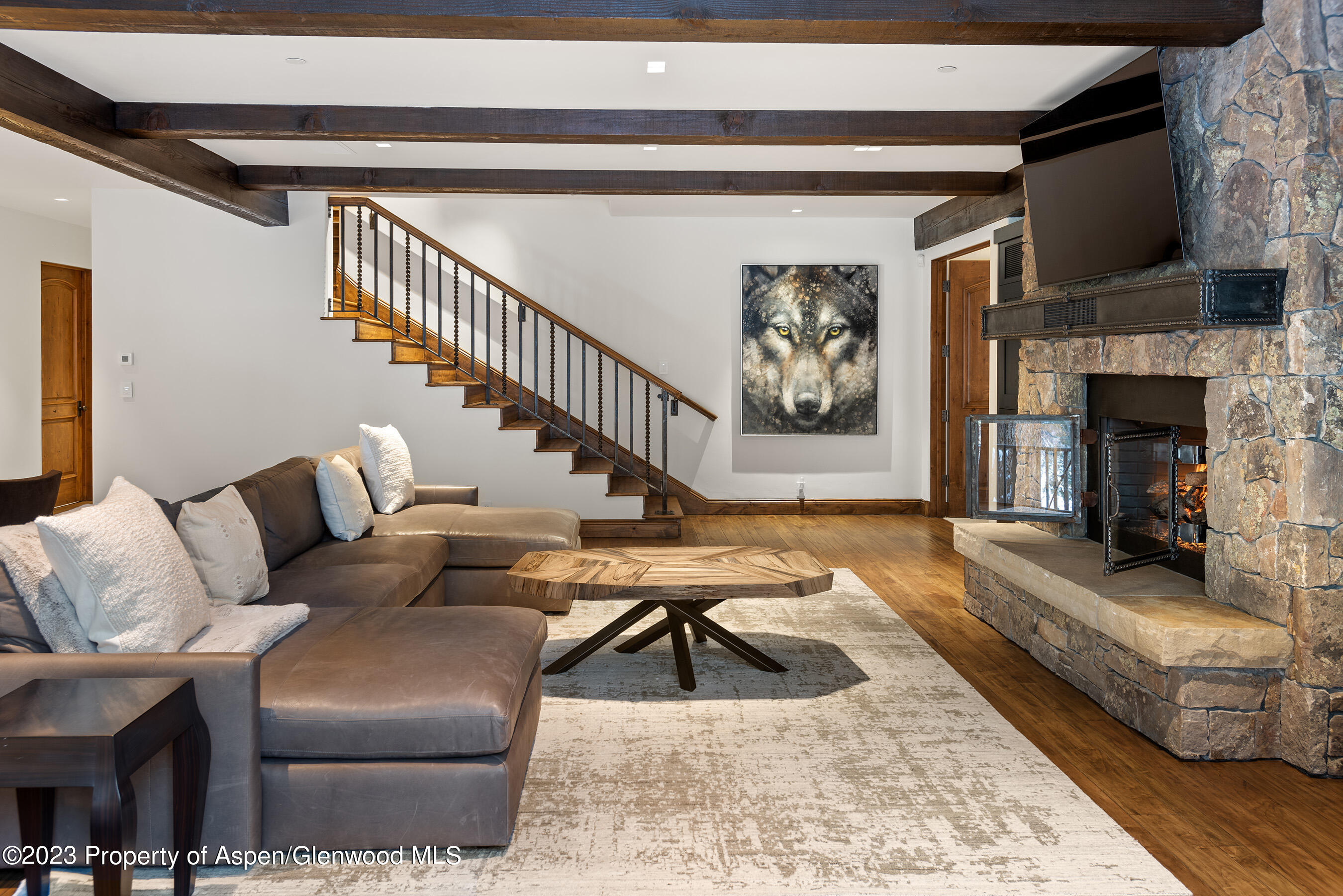 1819 Maroon Creek Road Aspen, CO 81611 - Photo 22 of 43 a living room with furniture and a fireplace