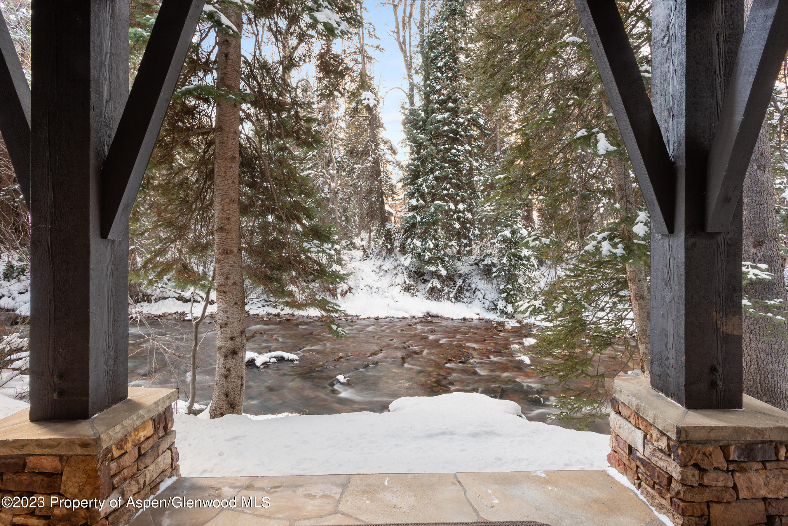 1819 Maroon Creek Road Aspen, CO 81611 - Photo 27 of 43 a view of a yard with plants and trees