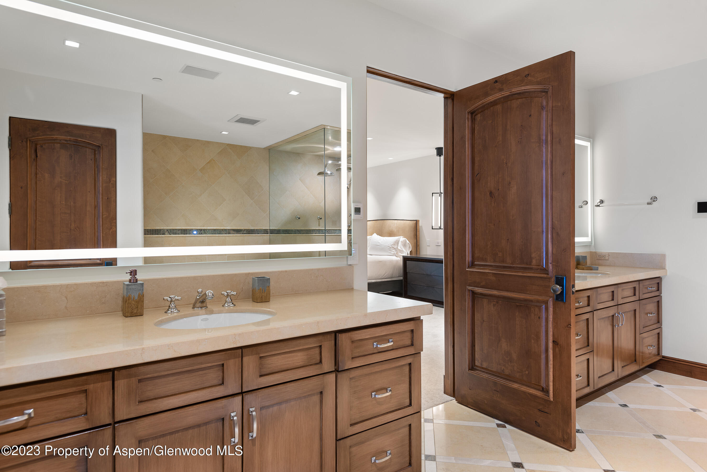 1819 Maroon Creek Road Aspen, CO 81611 - Photo 29 of 43 a bathroom with a sink and a mirror