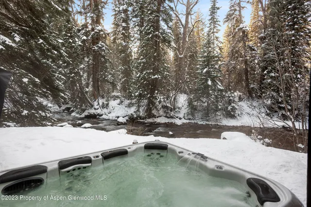 a view of a balcony with yard