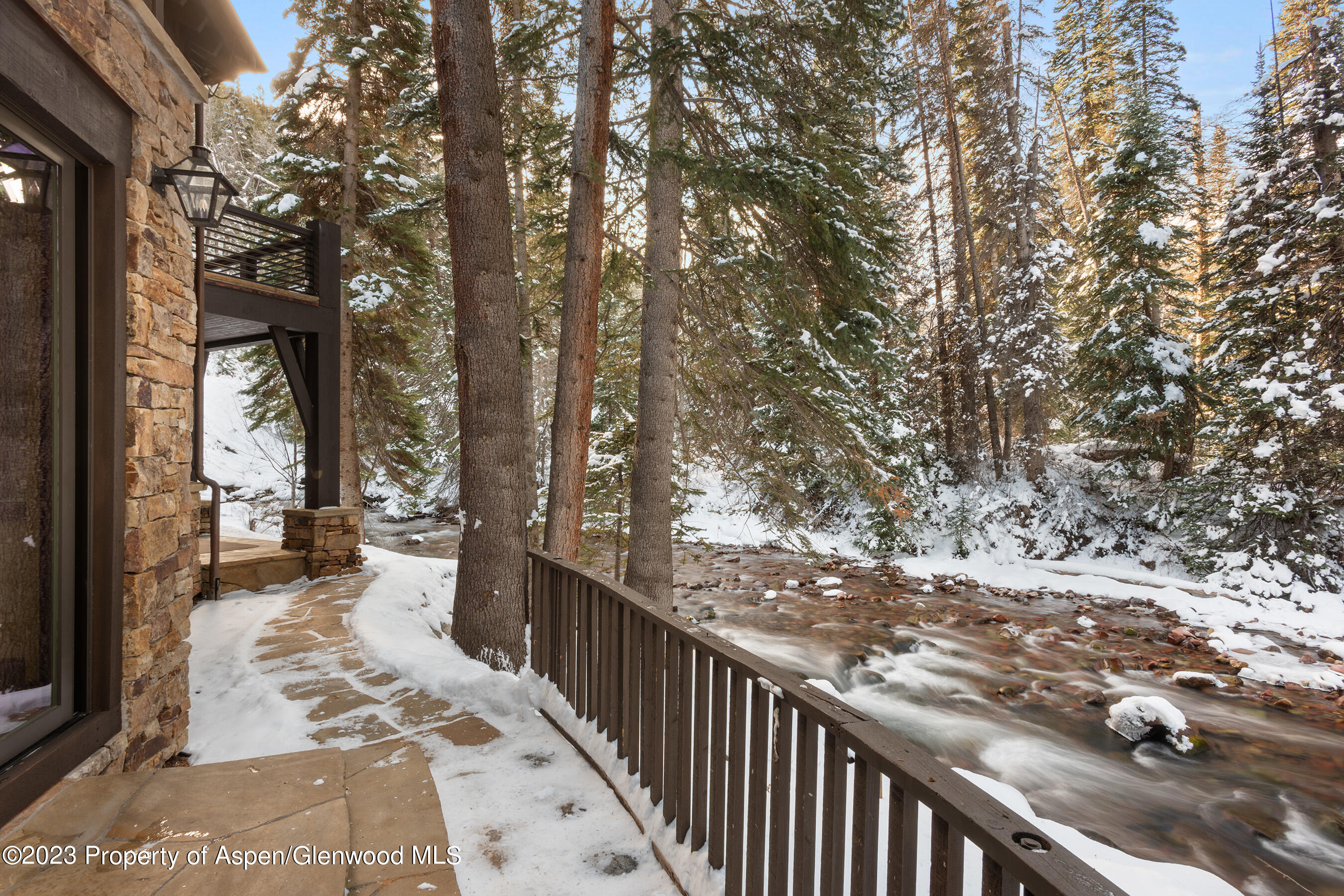 1819 Maroon Creek Road Aspen, CO 81611 - Photo 31 of 43 a view of a balcony with yard