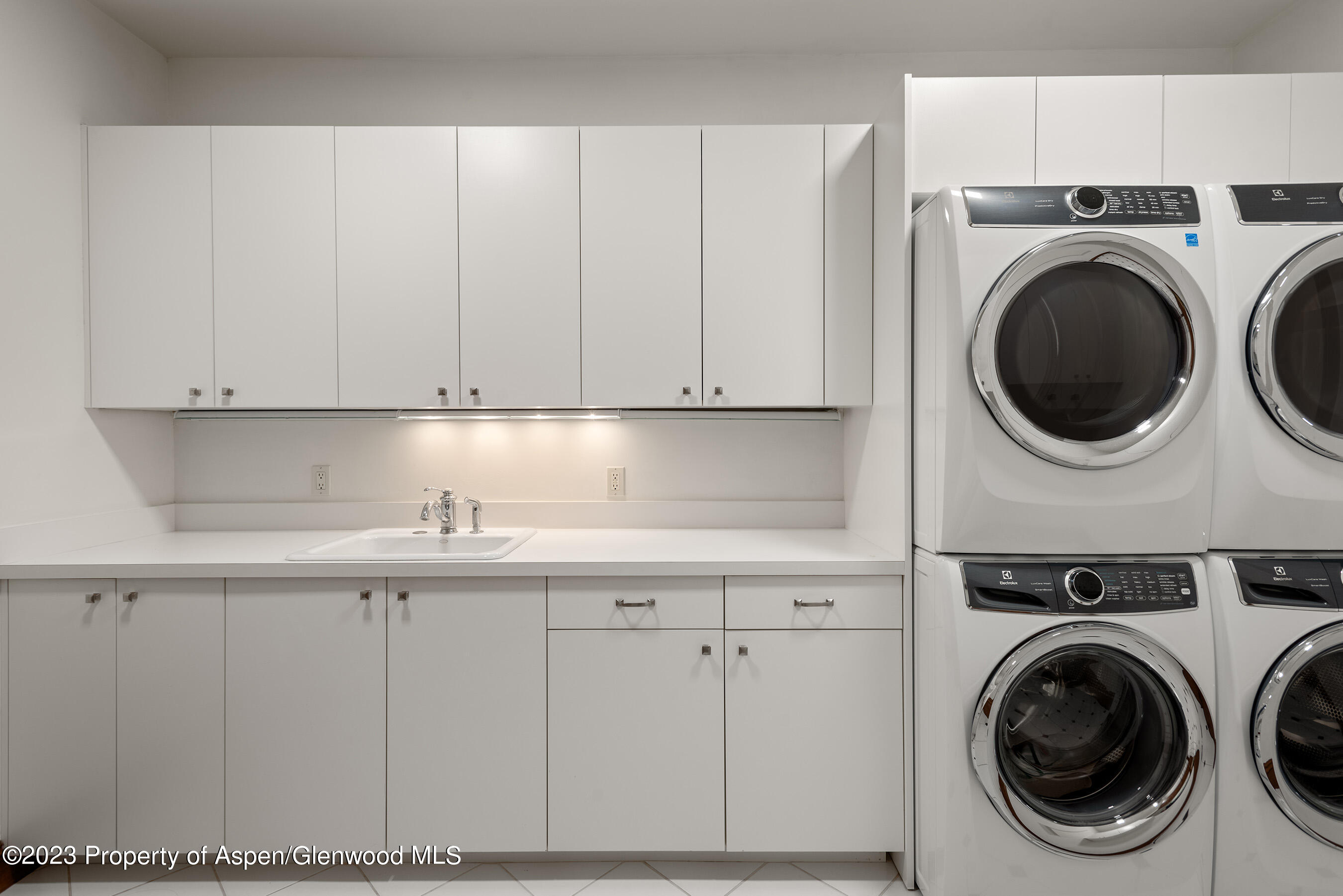 1819 Maroon Creek Road Aspen, CO 81611 - Photo 36 of 43 a utility room with sink dryer and washer