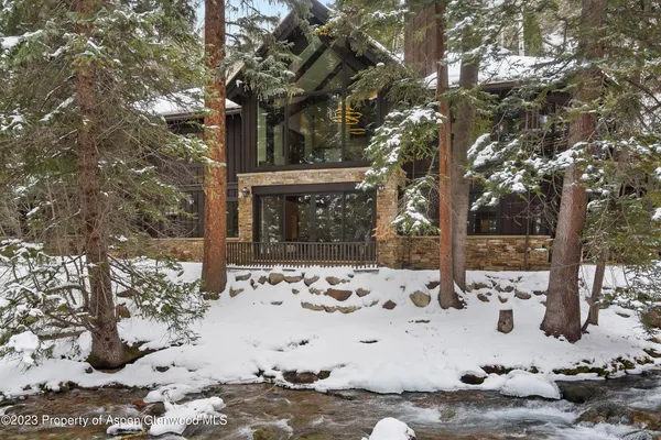 a backyard view with a seating space