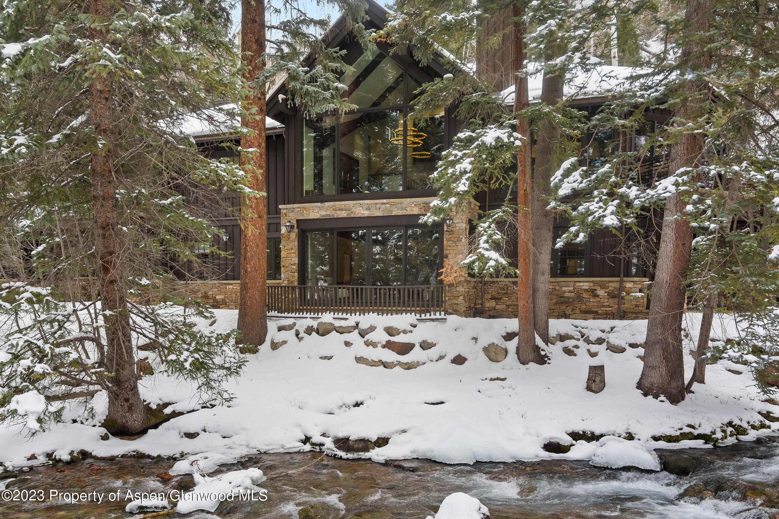 1819 Maroon Creek Road Aspen, CO 81611 - Photo 38 of 43 a view of a yard covered in snow