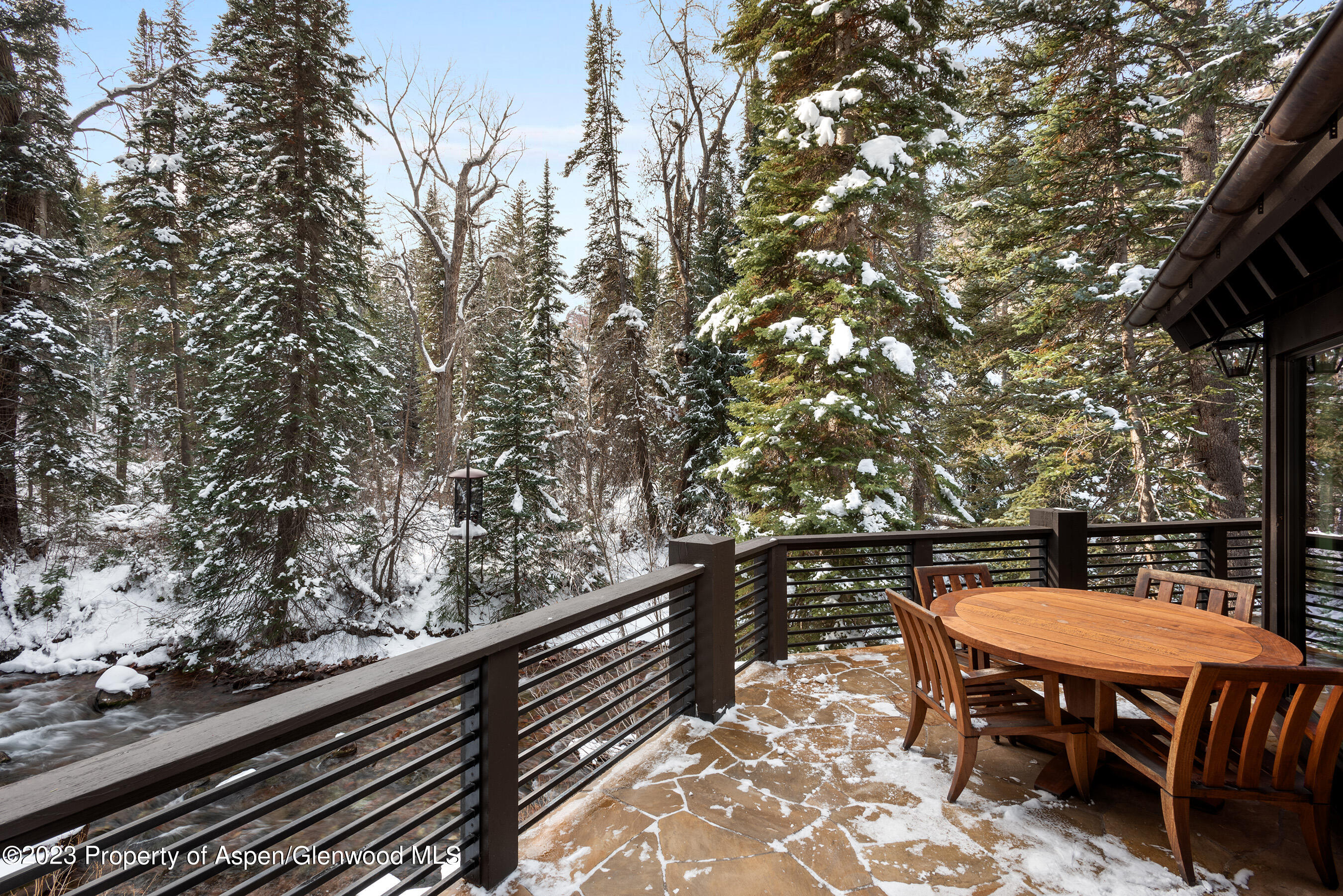 1819 Maroon Creek Road Aspen, CO 81611 - Photo 39 of 43 a backyard view with a seating space