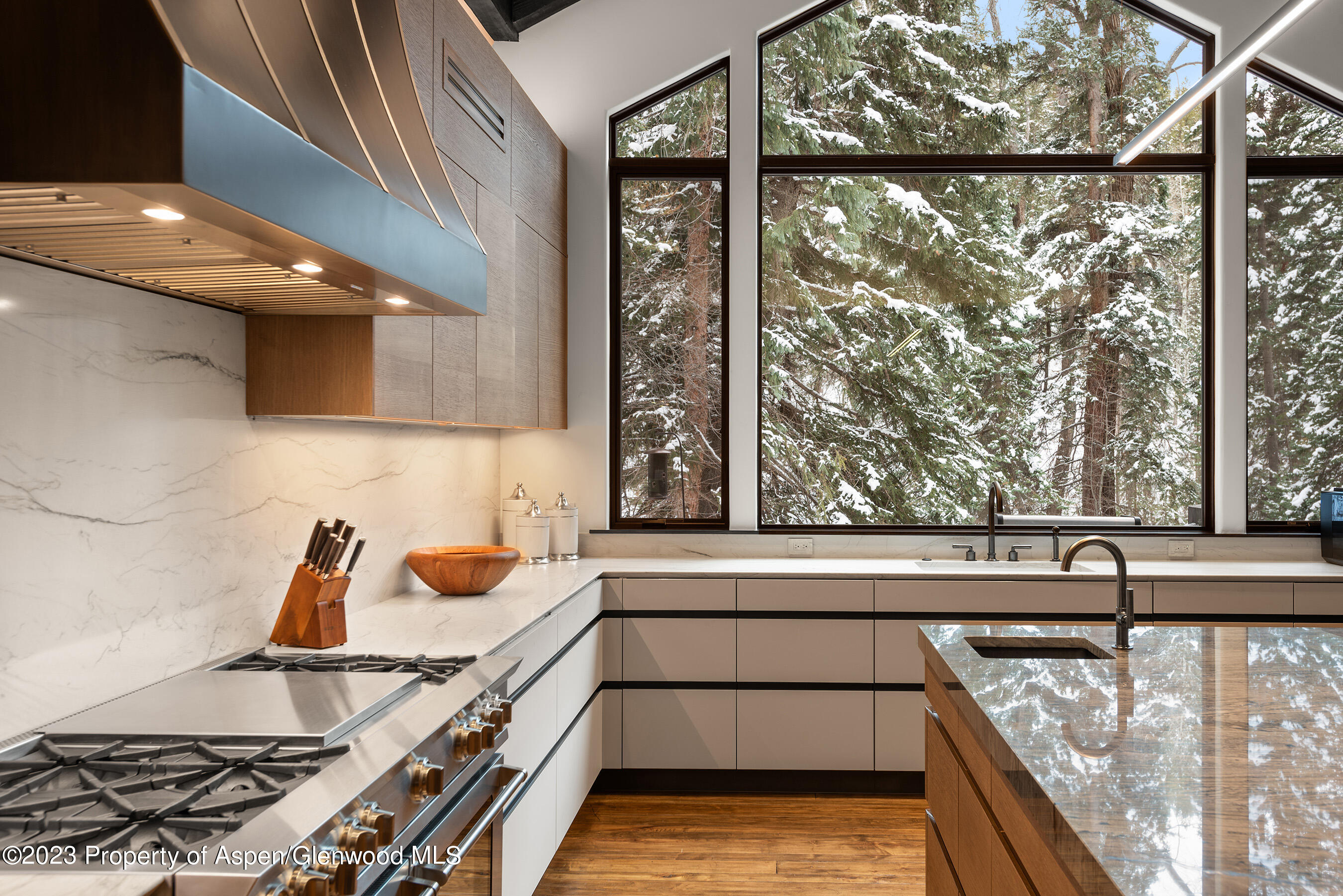 1819 Maroon Creek Road Aspen, CO 81611 - Photo 6 of 43 a view of a kitchen with a large window and a sink