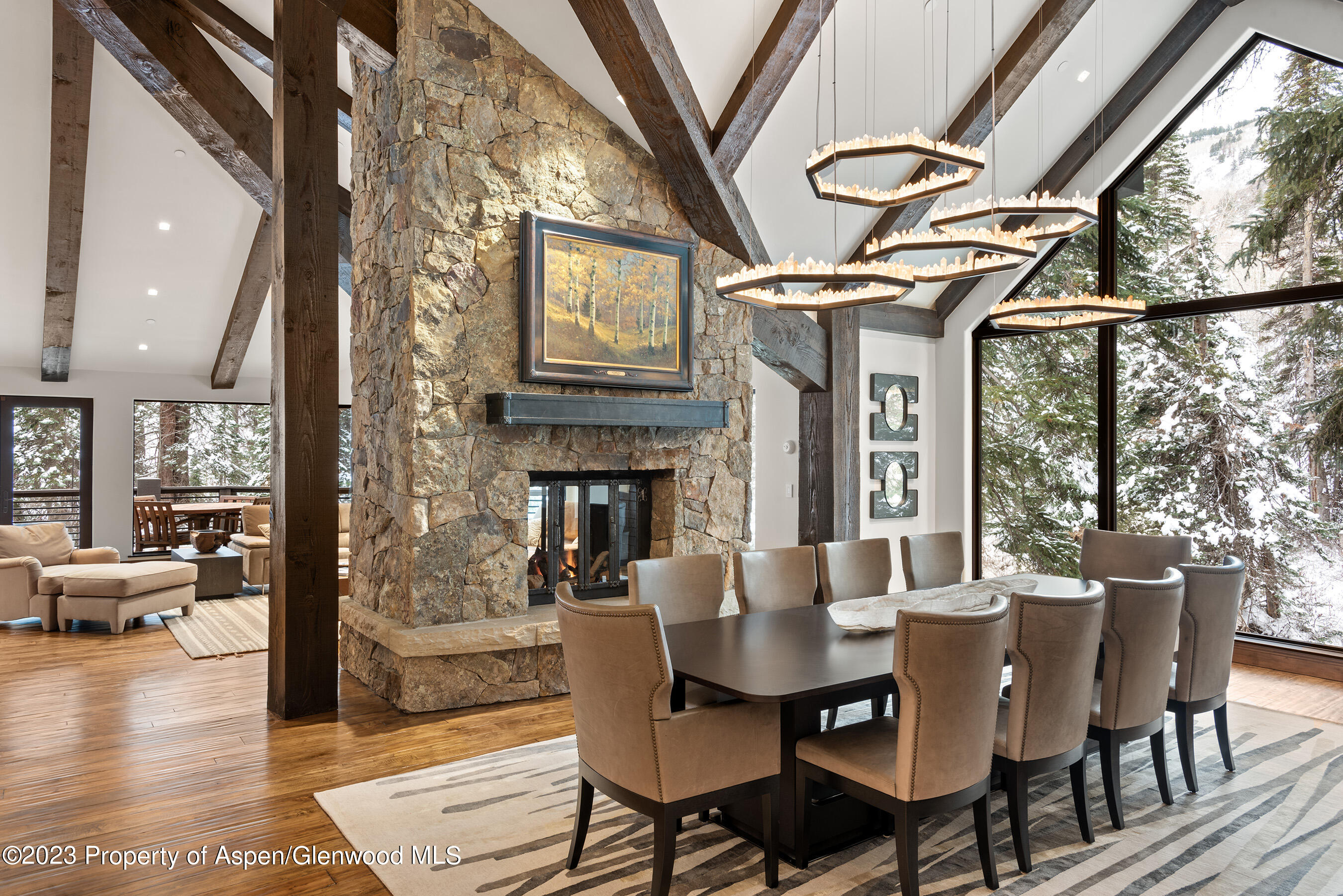 1819 Maroon Creek Road Aspen, CO 81611 - Photo 8 of 43 a view of a dining room with furniture window and wooden floor