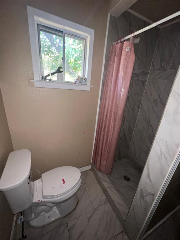 9104 Farmers Road White Settlement, TX 76108 - Photo 16 of 40 Bathroom featuring a stall shower and marble finish floors