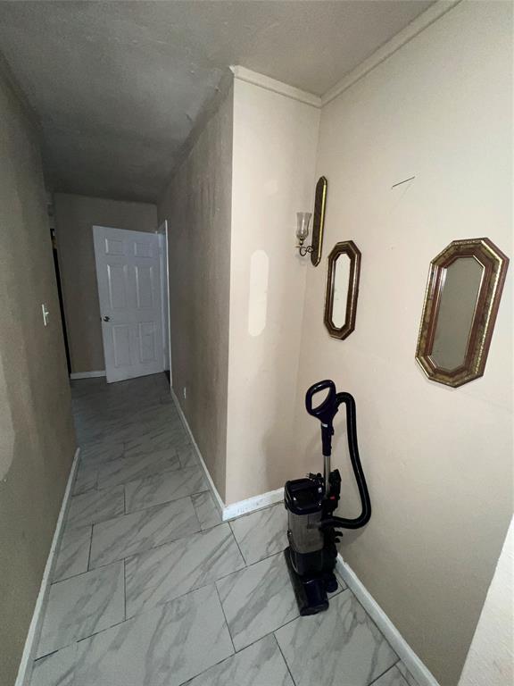 9104 Farmers Road White Settlement, TX 76108 - Photo 19 of 40 Hall with light marble finish flooring and baseboards
