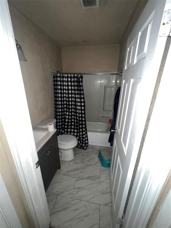 9104 Farmers Road White Settlement, TX 76108 - Photo 4 of 40 Full bath with vanity, shower / tub combo, and light marble finish flooring