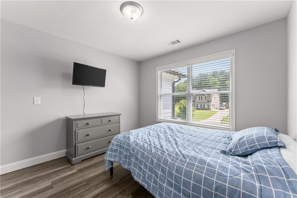 6401 Vista Point Lula, GA 30554 - Photo 16 of 58 a bedroom with a bed and a flat screen tv