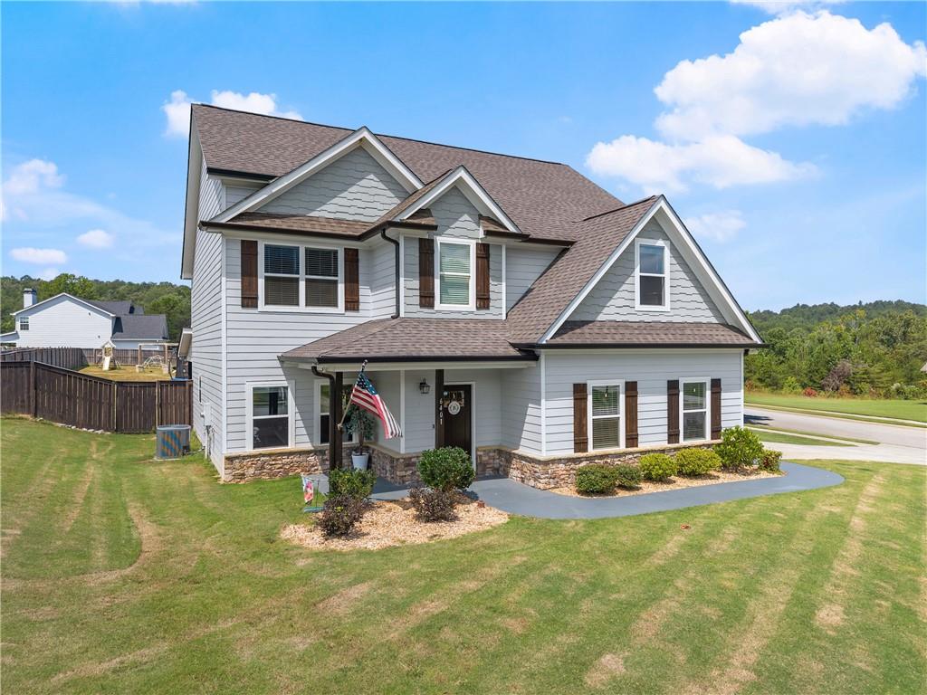 6401 Vista Point Lula, GA 30554 - Photo 2 of 58 a front view of a house with a yard table and chairs