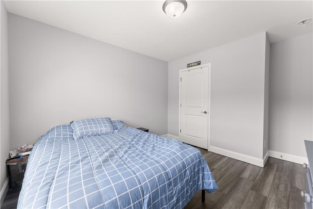 6401 Vista Point Lula, GA 30554 - Photo 26 of 58 a bedroom with a bed and wooden floor