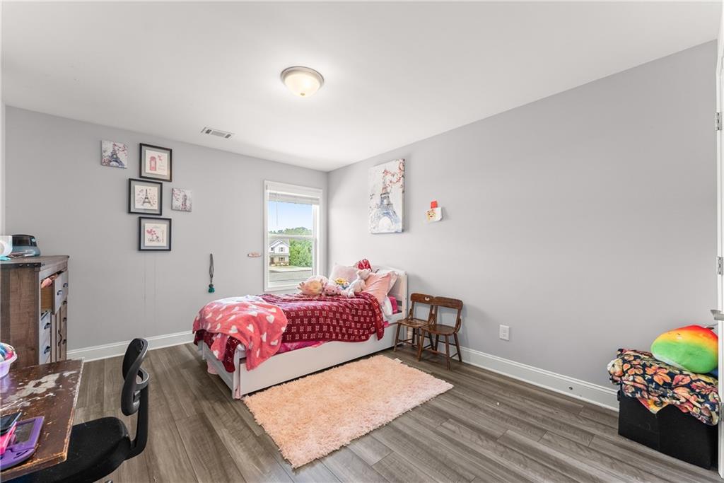 6401 Vista Point Lula, GA 30554 - Photo 27 of 58 a bedroom with a bed and a desk