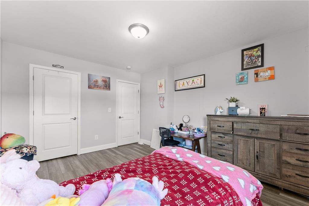 6401 Vista Point Lula, GA 30554 - Photo 28 of 58 a bedroom with a bed and a dresser in it