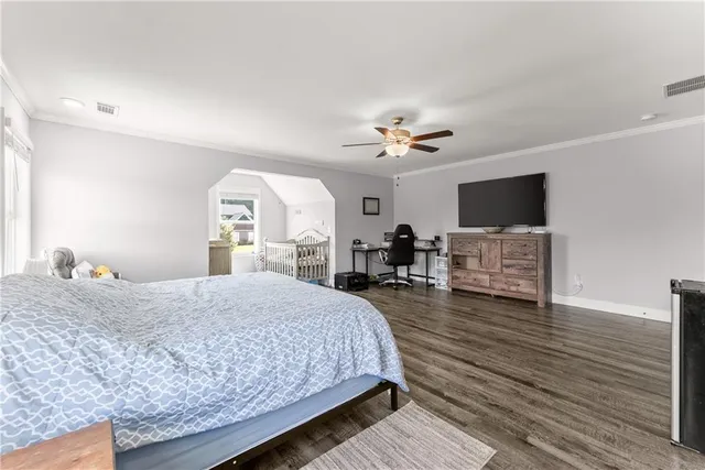 a bedroom with furniture and a window