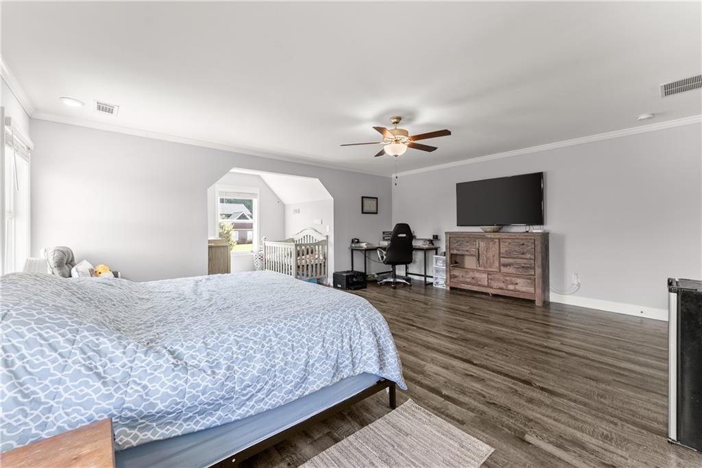 6401 Vista Point Lula, GA 30554 - Photo 33 of 58 a spacious bedroom with a large bed and a flat screen tv