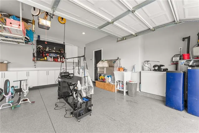 a view of a house with swimming pool and sitting area