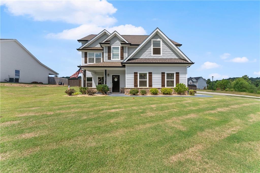 6401 Vista Point Lula, GA 30554 - Photo 4 of 58 a front view of a house with a yard