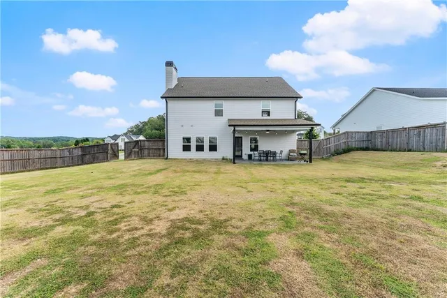a view of a large body of water with a building in the background