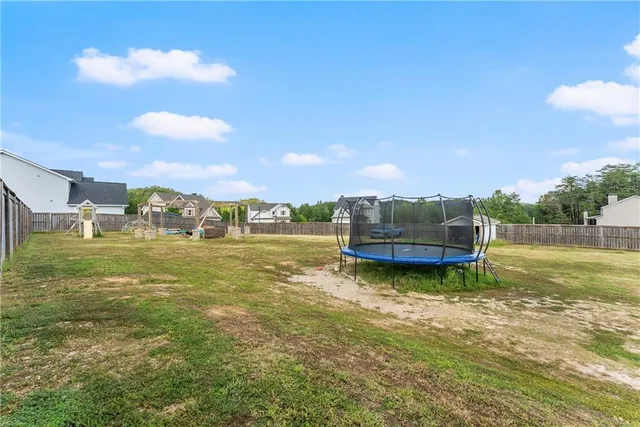 a view of a swimming pool with a lounge chair
