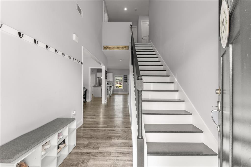 6401 Vista Point Lula, GA 30554 - Photo 6 of 58 a view of entryway and hall with wooden floor