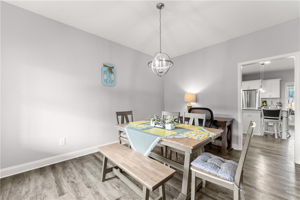 6401 Vista Point Lula, GA 30554 - Photo 7 of 58 a view of a dining room with a table and chairs
