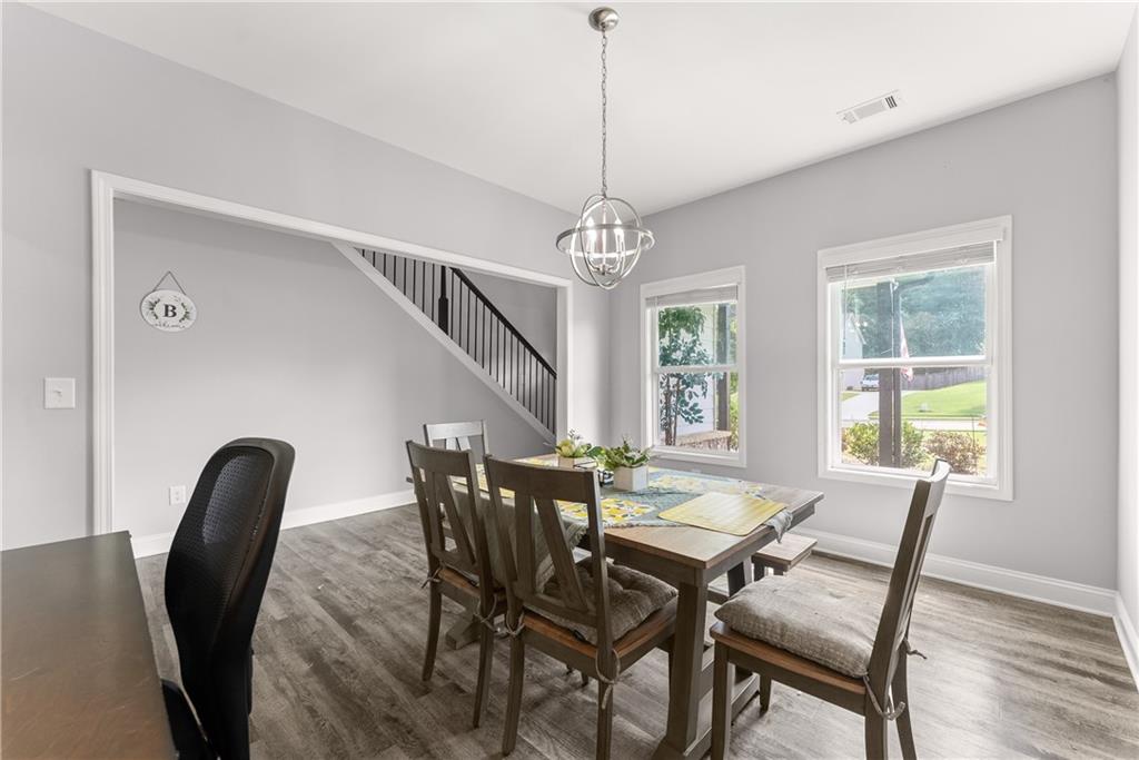 6401 Vista Point Lula, GA 30554 - Photo 8 of 58 a view of a dining room with furniture window and wooden floor