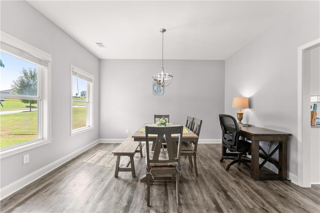 6401 Vista Point Lula, GA 30554 - Photo 9 of 58 a view of a dining room with furniture window and wooden floor
