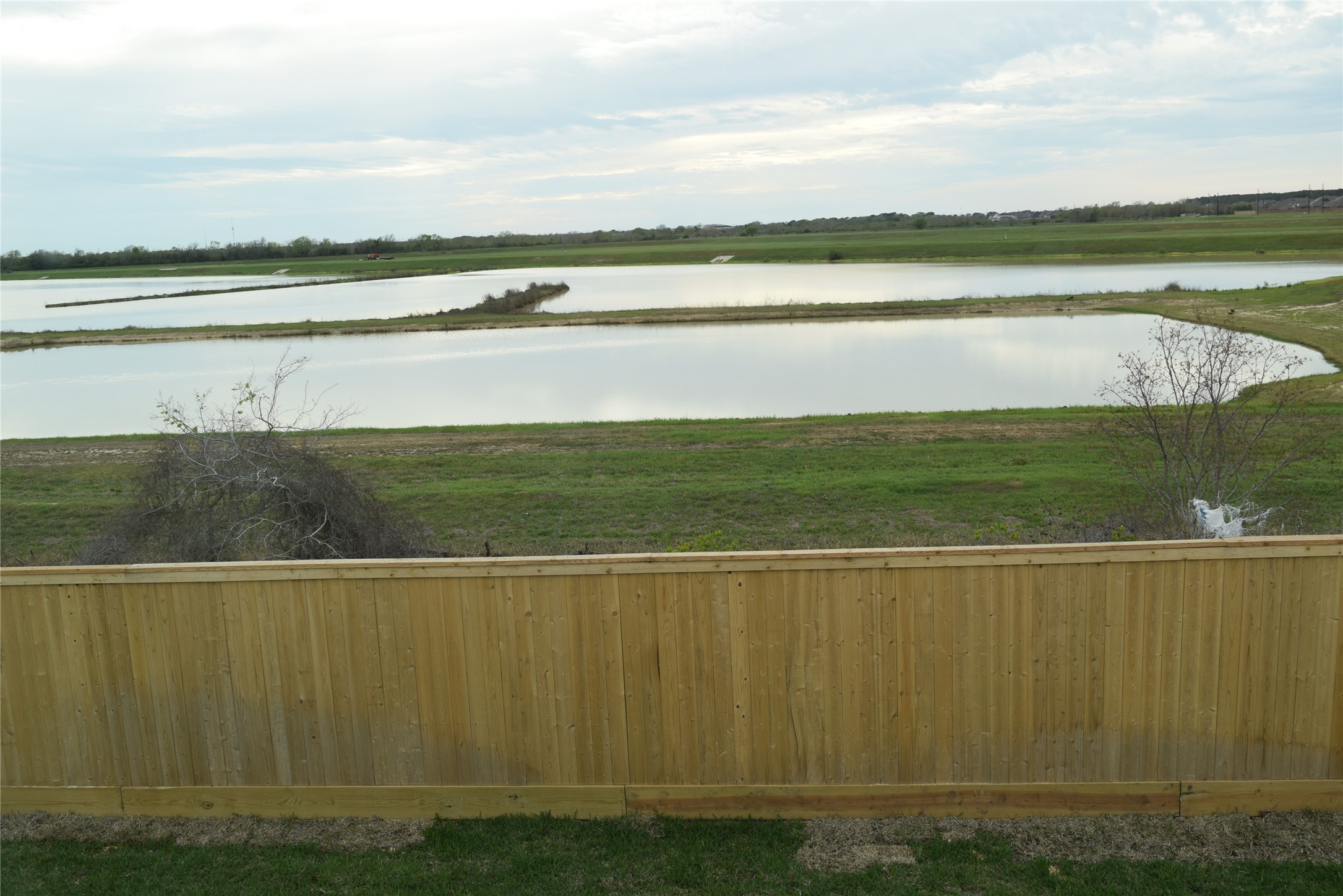 5835 Fresh View Court Katy, TX 77493 - Photo 18 of 21 a view of a lake with a big yard