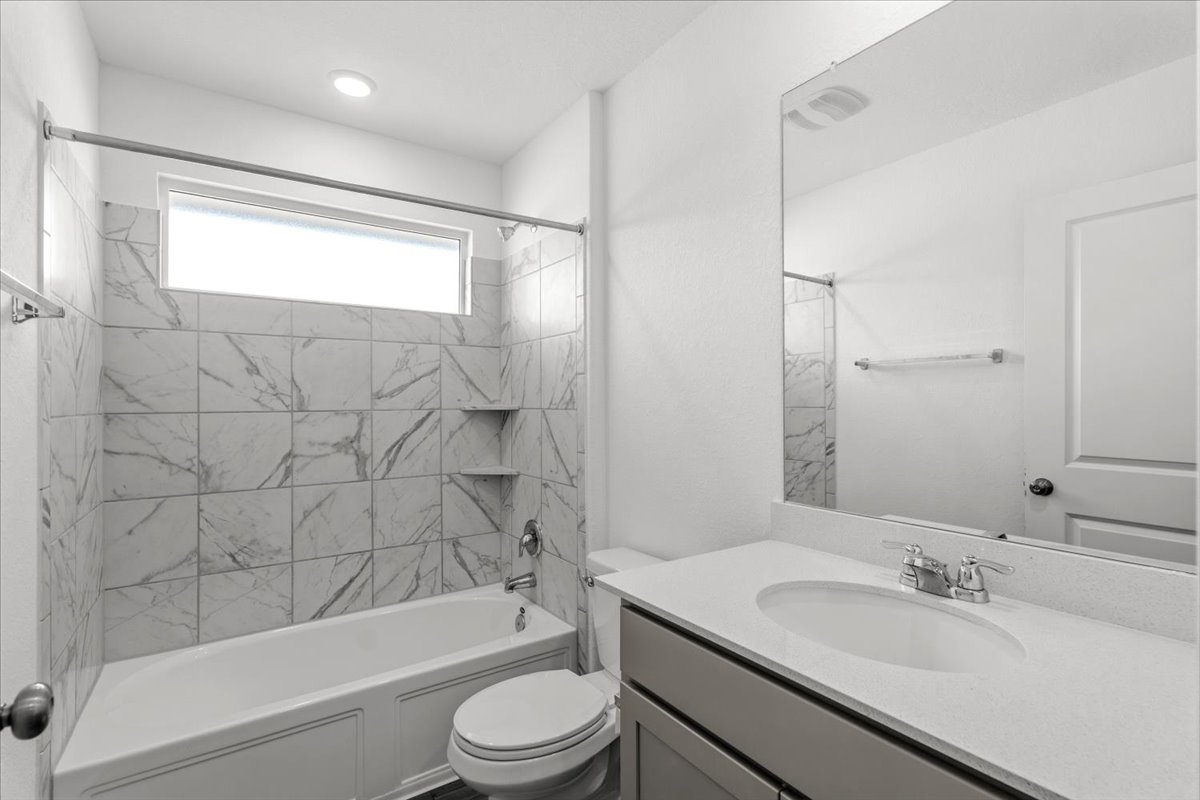 167 Jeffers Kyle, TX 78640 - Photo 13 of 40 Bathroom with vanity and shower combination