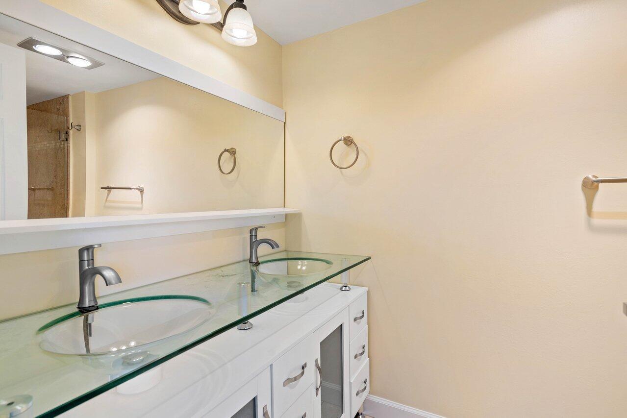 1200 Marine Way, Unit 915 (PH7) North Palm Beach, FL 33408 - Photo 11 of 29 a bathroom with a sink and a mirror