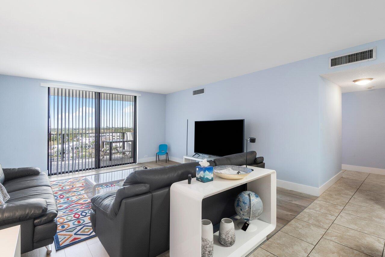 1200 Marine Way, Unit 915 (PH7) North Palm Beach, FL 33408 - Photo 4 of 29 a bedroom with a bed and a flat screen tv