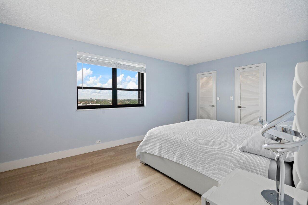 1200 Marine Way, Unit 915 (PH7) North Palm Beach, FL 33408 - Photo 10 of 29 a bedroom with a bed and a window