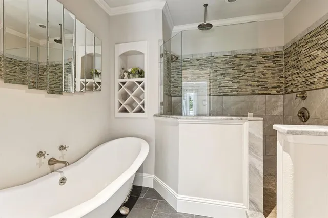 a bathroom with shower and bathtub