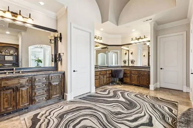 a bedroom with a bed and glass door