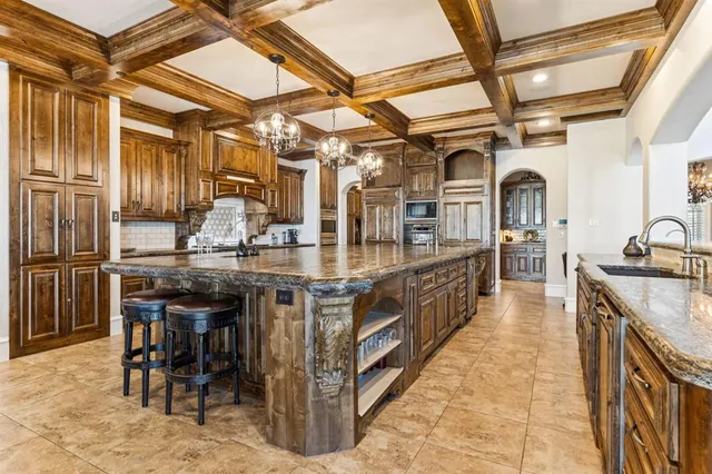 a kitchen with stainless steel appliances granite countertop lots of counter top space