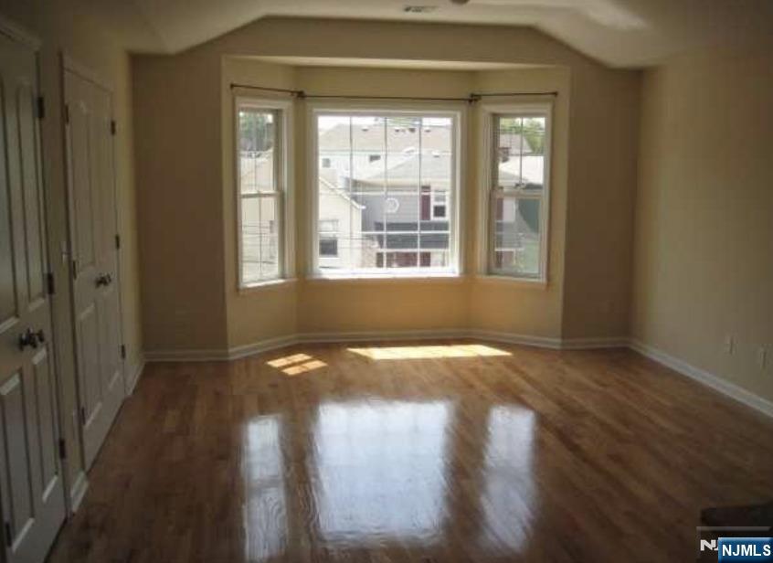 211 North 3rd Street, Unit 2 Harrison, NJ 07029 - Photo 2 of 6 a view of an empty room and window