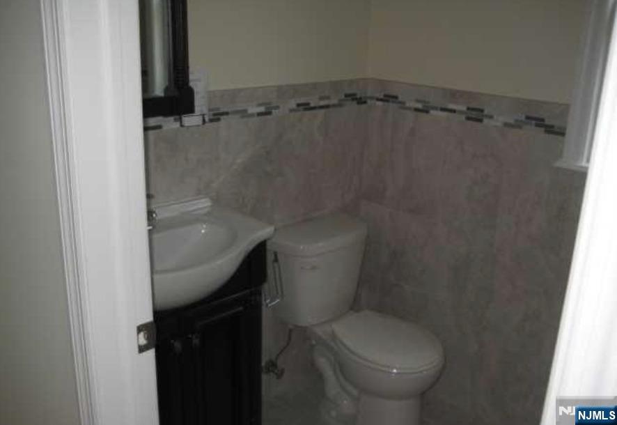 211 North 3rd Street, Unit 2 Harrison, NJ 07029 - Photo 4 of 6 a bathroom with a toilet and a shower