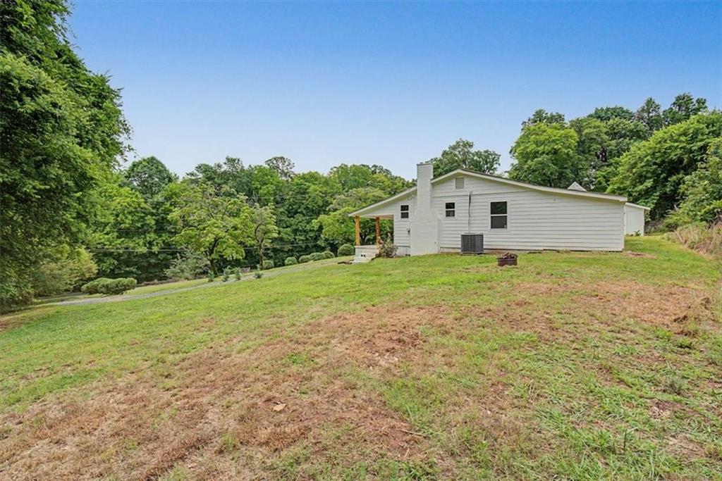2115 King Road Dalton, GA 30720 - Photo 38 of 54 a house with garden in front of it