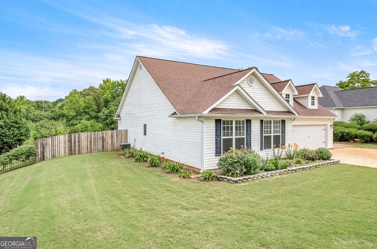 82 Newton Road LaGrange, GA 30240 - Photo 2 of 45 a view of a house with a yard and plants