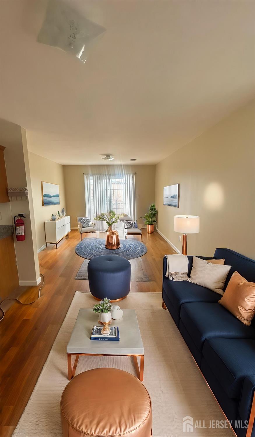 663 South Park Street Elizabeth, NJ 07206 - Photo 2 of 11 a living room with furniture a rug and a lamp