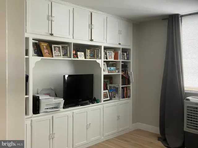 a view of cabinets and wooden floor