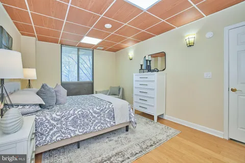 a bedroom with a bed and a walk in closet