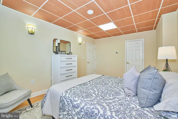 a bedroom with a bed and a chair